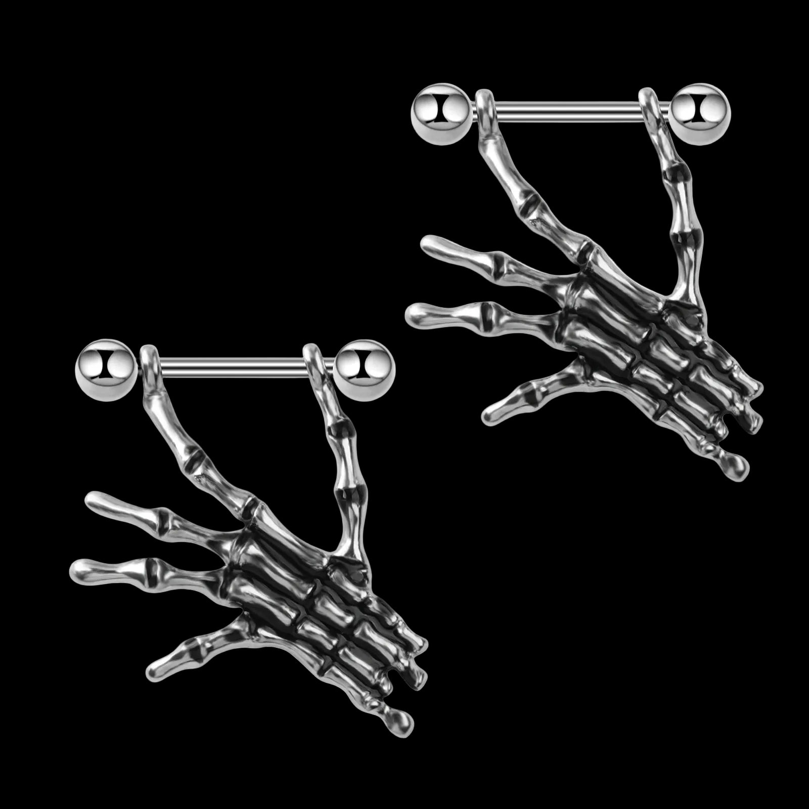 Skull hand nipple piercings